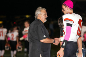 (Photo by Bri Nellis – brinellisphotography.shutterfly.com) Coach Wiser congratulates John Katis for becoming the all-time leading passer in Clarion history.