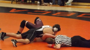 Karlin Hiles with a dominating pin against Cranberry.