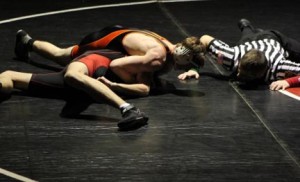 Riley Gunter (145lbs.) in the process of pinning his opponent