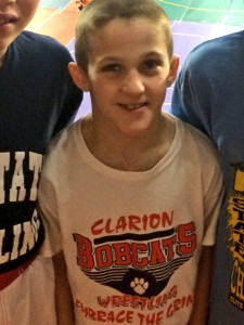 (Photo provided by the Reinsels)  Owen proudly wearing his Bobcat shirt at states.