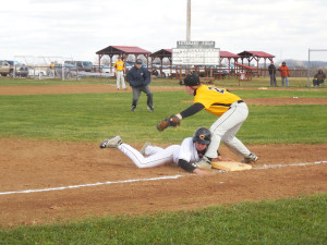 Pinch runner Caleb Wilson sliding in under the tag at third
