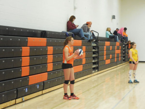 Dorothy Kalinowsky setting up to serve in a 7th Grade game