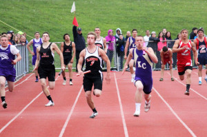 (Photo by G. Chad Thomas) Cody Hearst finishes 4x100 after taking handoff from Zach Hill