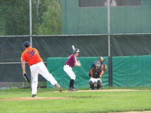 (Photo by Monica Goheen) Tyler Schmader on the mound, Curvin Goheen at bat, Lake Staub behind the plate 