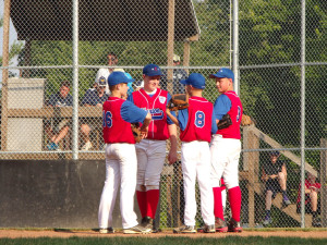 (Photo by Monica Goheen) Conference at the mound during game at Butler