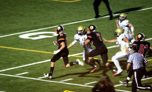 (Photo by G. Chad Thomas) Thomas goes into the endzone. A fine block by Ethan