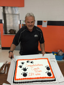 (Photo provided by David Hartley) Coach Wiser with the cake presented in honor of his 184th win