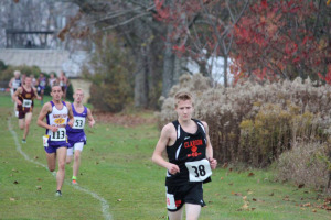 (Photo by Mark Bettwy) Liam leading the field in District Nine Meet