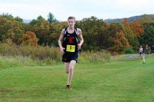 (Photo by Matt Lerch) Liam Raehsler out in front in the Varsity Boys Race