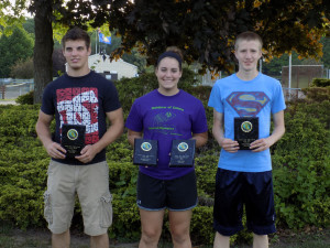 State Meet Participants Ian Corbett, Jenn Ochs and Liam Raehsler with awards they received at the picnic