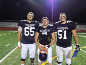 Destin flanked by DuBois' Peterson twins, Joe #65 and Brad #51 (North Defensive MVP)