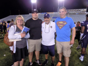 Coach Wiser (center), wife Annie (left), son Ryan (right), Clarion line coach (Nate McClaine second from left