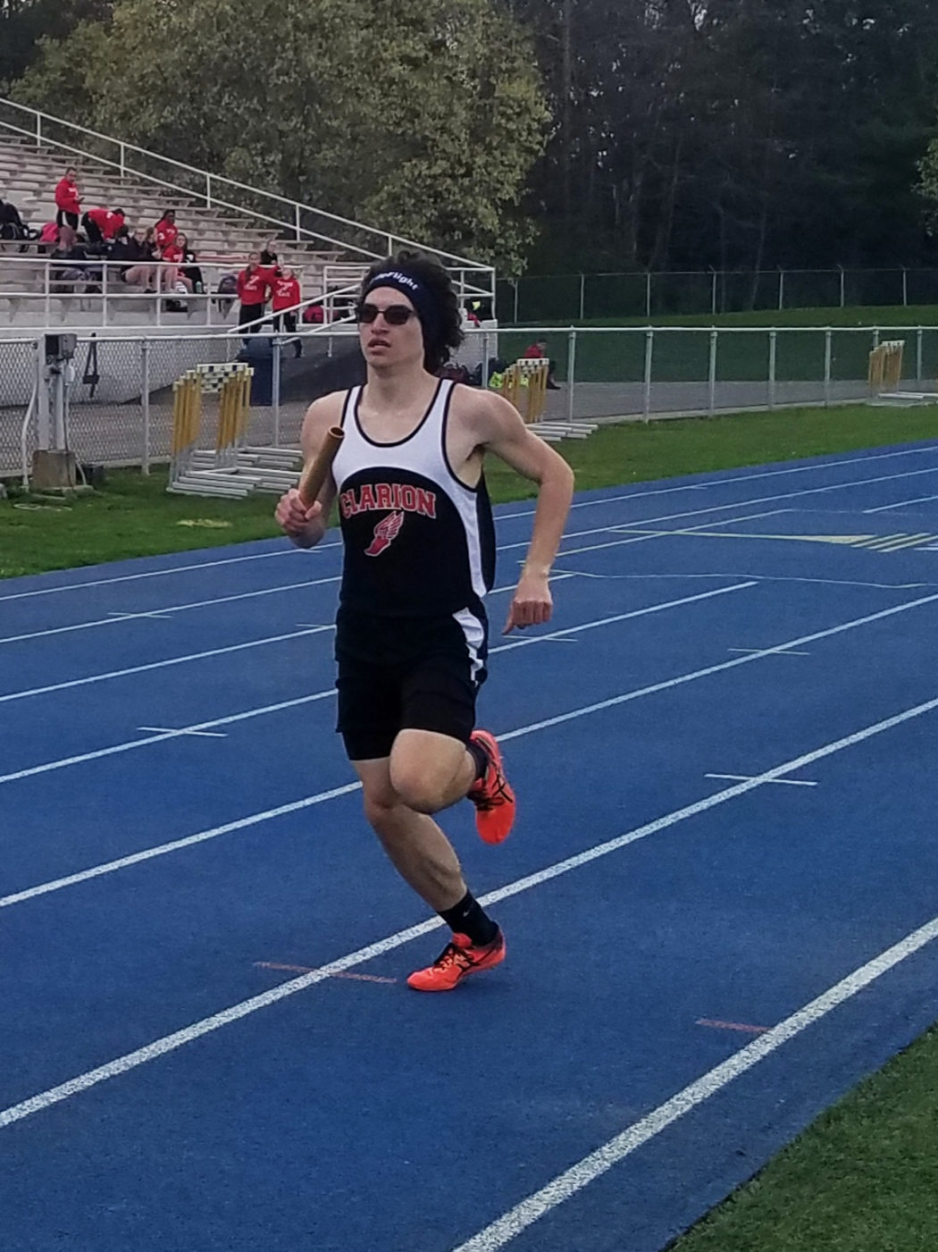 https://clarionsportszone.com/wp-content/uploads/2019/04/Track-and-Field-2019-2-Noah-Schill-relay-against-Moniteau-1050x1401.jpg