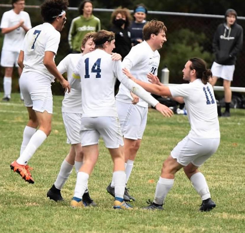 https://clarionsportszone.com/wp-content/uploads/2020/10/Soccer-2020-Mindi-Verdilll-Team-celebration-after-the-overtime-goal.jpg