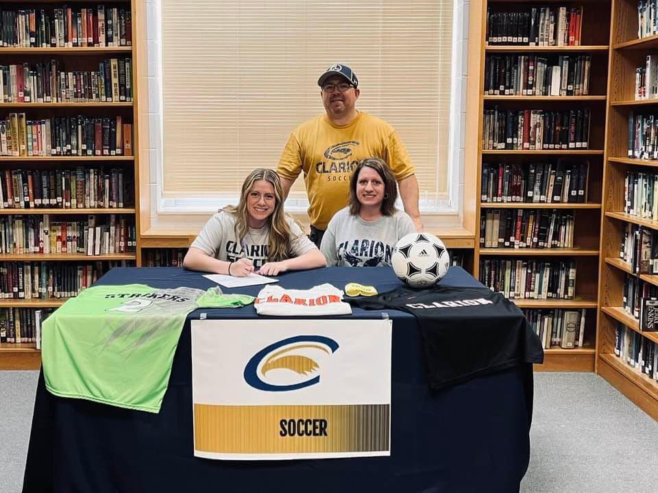 https://clarionsportszone.com/wp-content/uploads/2024/06/Lexie-Coull-signing-3-Parents-Rob-and-Jessica.jpg
