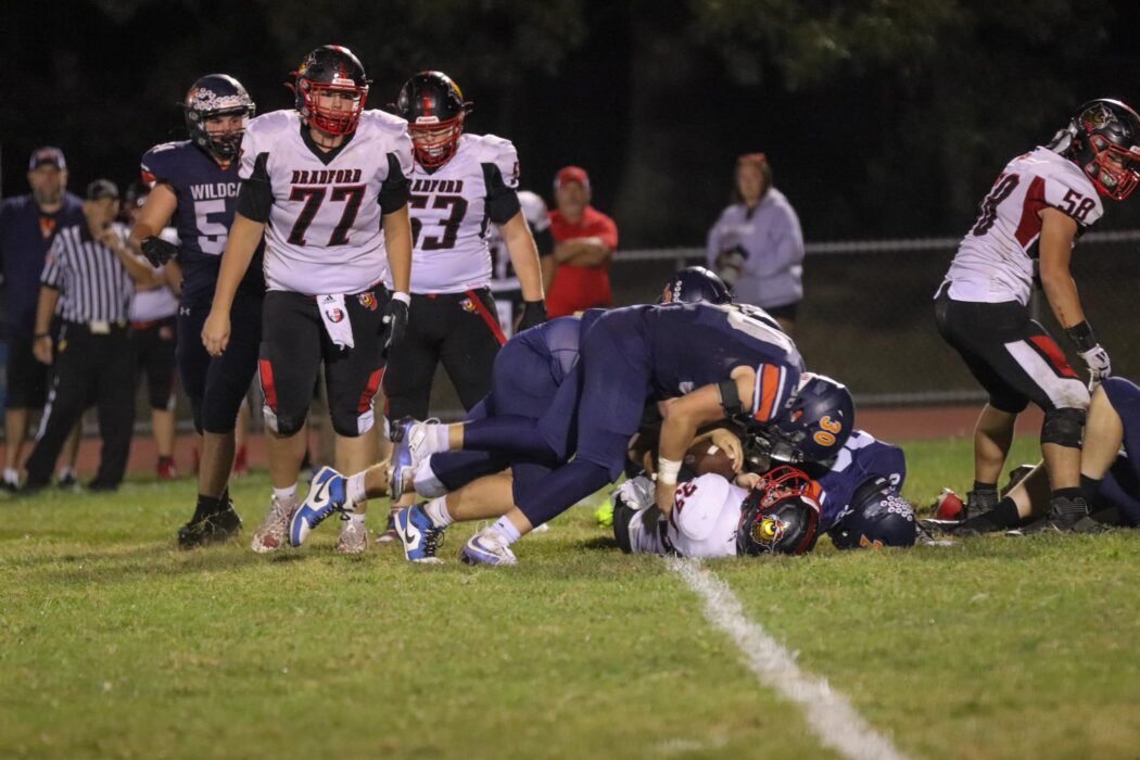 https://clarionsportszone.com/wp-content/uploads/2024/09/Wildcat-Football-2024-Brinley-Kiskadden-BK-Media-Bradford-Braylon-Beckwith-30-and-others-on-tackle-1050x700.jpg