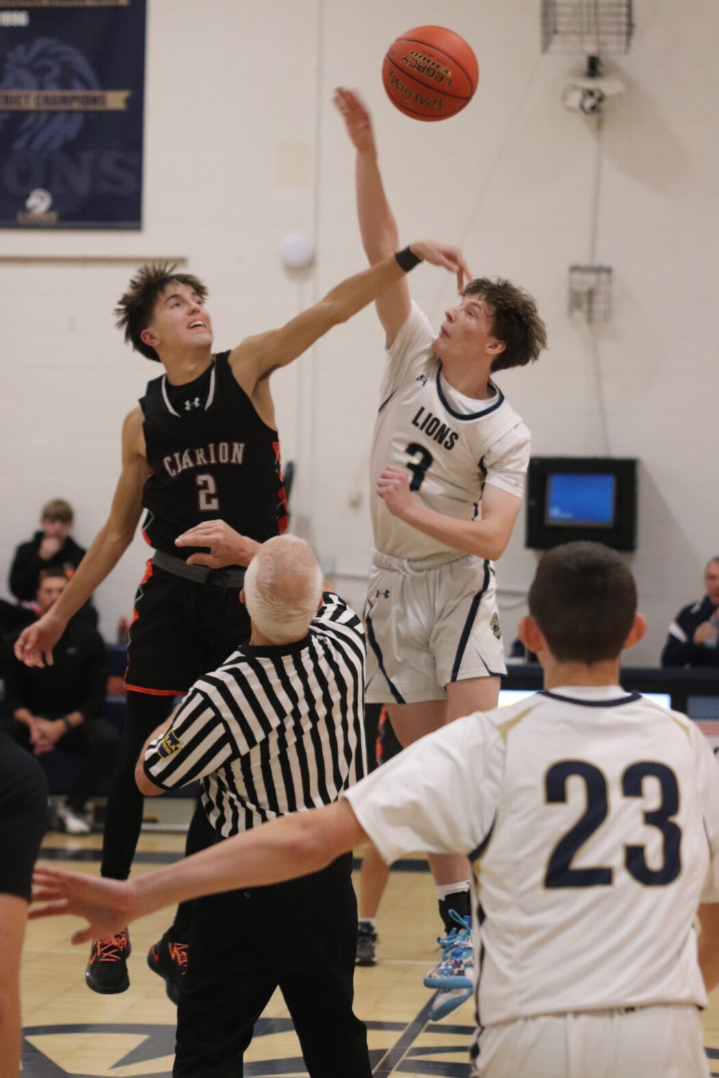 https://clarionsportszone.com/wp-content/uploads/2024/12/Boys-Basketball-2024-25-C-L-Away-Diane-Lutz-Nathan-Frederick-and-Aiden-Wilson-opening-jump-1050x1575.jpg