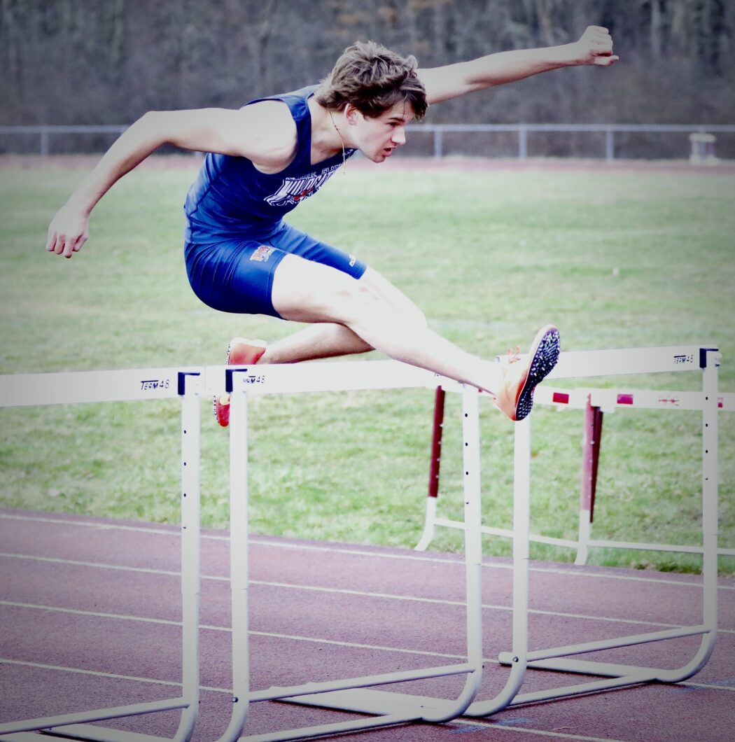 https://clarionsportszone.com/wp-content/uploads/2025/04/Wildcats-Track-and-Field-2025-1a-Cranberry-Mason-Burford-in-the-100-hurdles-Matt-Lerch-1050x1060.jpg